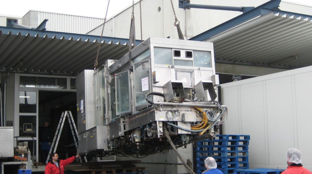 Machine being loaded for transport
